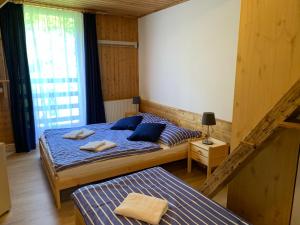 Postel nebo postele na pokoji v ubytování Penzion a Restaurace Vyhlídka