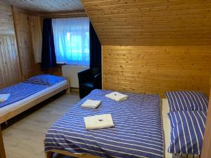 Postel nebo postele na pokoji v ubytování Penzion a Restaurace Vyhlídka