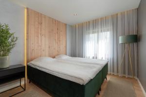 מיטה או מיטות בחדר ב-Põlva Maja apartments - contactless check-in