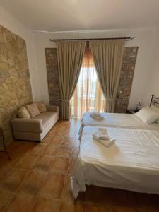 Postel nebo postele na pokoji v ubytování Vathi Hotel