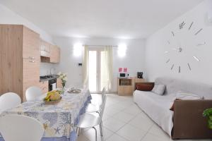 a living room with a table with bananas on it at IzzHome New One in Pula