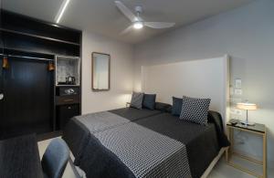 Кровать или кровати в номере Hotel Perla del Sur