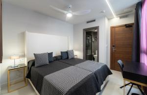Кровать или кровати в номере Hotel Perla del Sur