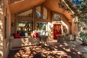 a building with a red door and a window at MySedonaGold, The Place to Chill in Sedona in Sedona