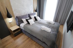 Postel nebo postele na pokoji v ubytování Apartament NEBULA - MTN Gardenia Seaside Dziwnów