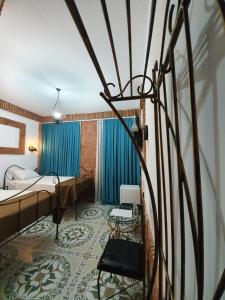 A bed or beds in a room at Janashia Boutique Hotels