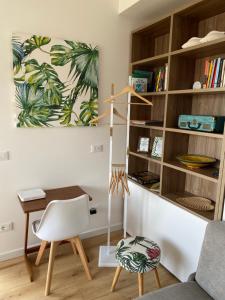 a living room with a desk and a chair at CaseMaggi Sea View Terrace in Portovenere