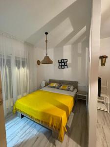 Postel nebo postele na pokoji v ubytování Apartments Tina