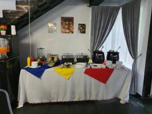 a table with a colorful table cloth on it at Vila 4 Anotimpuri in Moieciu de Sus