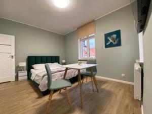 Postel nebo postele na pokoji v ubytování Apartament Kleopatra