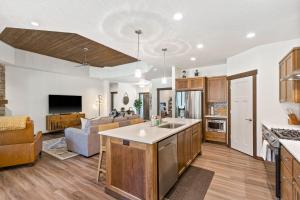 an open kitchen and living room with a couch at The Lazy Bear in Priest River
