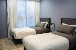 JF Three Bedroom Apartment客房内的一张或多张床位