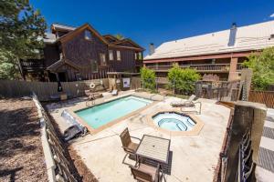 a backyard with a swimming pool and a house at 2BD 2BA Condo with Hot Tub and Pool in Park City