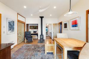 a living room with a wooden table and a dining room at Sound View in South Beach
