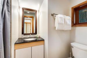 a bathroom with a sink and a mirror at Sound View in South Beach +31 photos