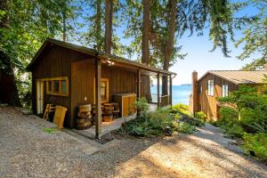 a small wooden house with a view of the ocean at Sound View in South Beach