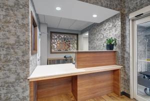 a bathroom with a sink and a window at Candlewood Suites Winchester by IHG in Winchester +41 photos