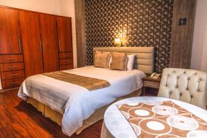 Postel nebo postele na pokoji v ubytování Hotel Chimborazo Internacional