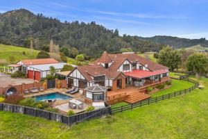 an aerial view of a large house with a pool at Chartré Manor B&B in Thames