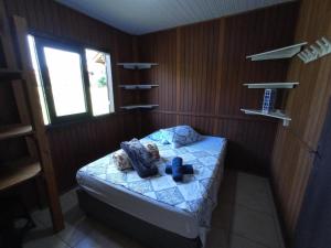 מיטה או מיטות בחדר ב-Pousada Biso Finoca Ibiraquera