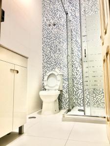 a bathroom with a toilet and a shower at Frank's House & Happy BELEM in Lisbon +57 photos