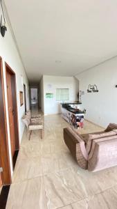 a living room with a couch and a table at Pousada Boa Vista in Canindé de São Francisco