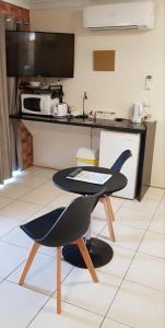 a chair sitting on top of a table in a kitchen at Gold Coast Airport Motel in Gold Coast