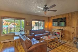 a living room with a couch and a table at Main St Condo in Tannhauser with Balcony! in Breckenridge