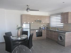 A kitchen or kitchenette at Marina Apartments 211
