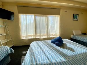 Cama o camas de una habitación en Rye Beach Motel Australia