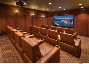 a conference room with brown chairs and a flat screen tv at Hyatt Vacation Club at Northstar Lodge in Truckee