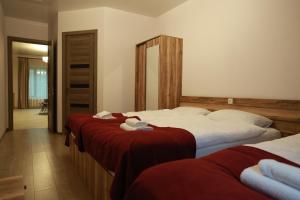 Postel nebo postele na pokoji v ubytování Paramount Kazbegi