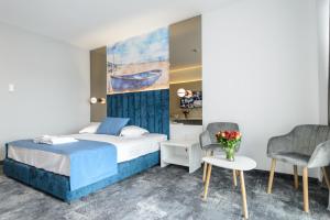 Кровать или кровати в номере Mirage Beach Spa Hotel
