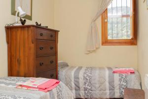 Łóżko lub łóżka w pokoju w obiekcie Rural puebla de san miguel