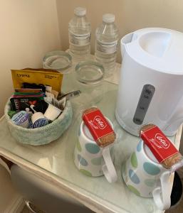 a counter top with a toaster and a tea pot at Willow Farm Way in Herne Bay