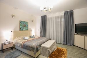 En eller flere senge i et værelse på Anastasia Mountain Apartment - Poiana Brasov + 29 billeder