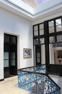 a staircase in a room with black and white at Montevideo Chic Hostel in Montevideo