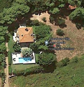 an aerial view of a house with a swimming pool at Villa Anna Maria in Kriopigi