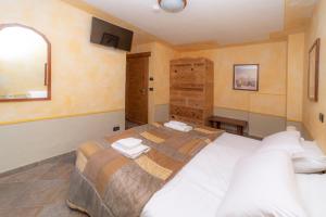 Postel nebo postele na pokoji v ubytování Hotel Gran Trun