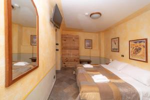 Postel nebo postele na pokoji v ubytování Hotel Gran Trun