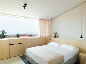 Postel nebo postele na pokoji v ubytování Criu Boutique Hotel