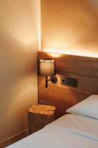 A bed or beds in a room at Hotel Boutique El Mariner
