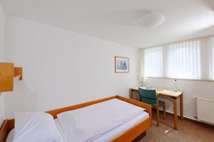 Ein Bett oder Betten in einem Zimmer der Unterkunft St. Bonifatius