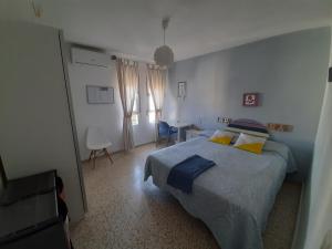 Posteľ alebo postele v izbe v ubytovaní Duplex en Huelva a 15 minutos en coche de las mejores playas de España