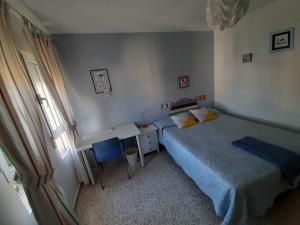 Posteľ alebo postele v izbe v ubytovaní Duplex en Huelva a 15 minutos en coche de las mejores playas de España