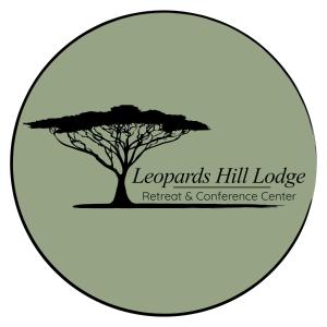 a tree in a circle with the logo of leparants hill lodge retreat at Leopards Hill Lodge in Lusaka