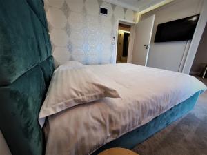 Ein Bett oder Betten in einem Zimmer der Unterkunft Casa Campeanu