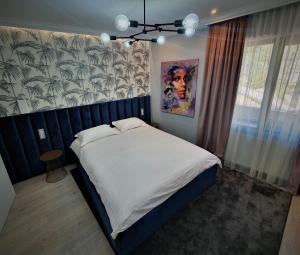 מיטה או מיטות בחדר ב-Casa Campeanu