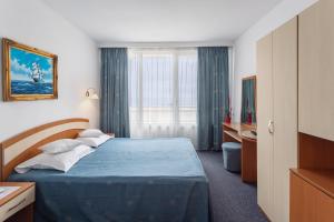Postel nebo postele na pokoji v ubytování Hotel Sirena Saturn All Inclusive