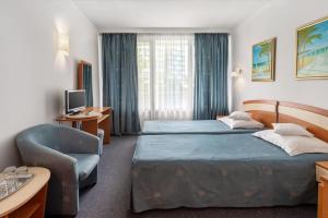 Postel nebo postele na pokoji v ubytování Hotel Sirena Saturn All Inclusive